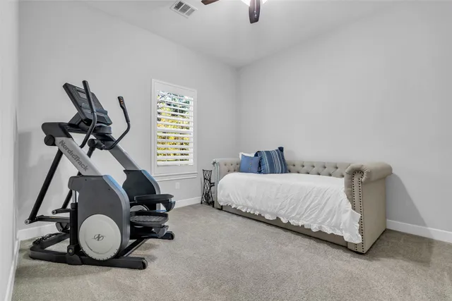 a bed room with furniture and a window