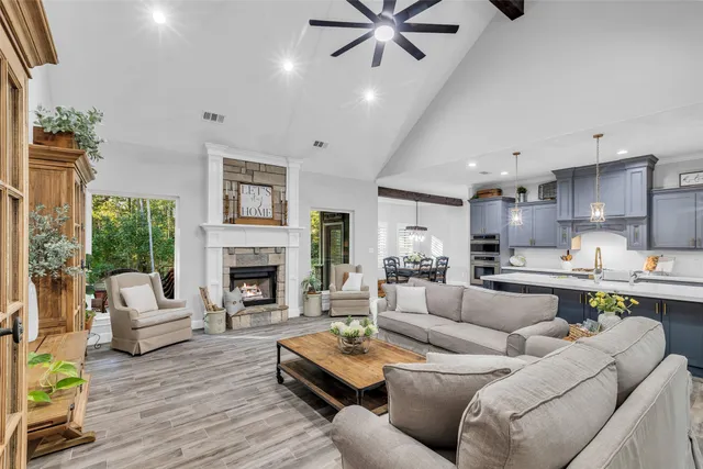 a living room with furniture and a fireplace