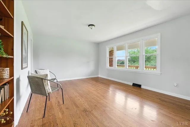 a view of a room with furniture and a window