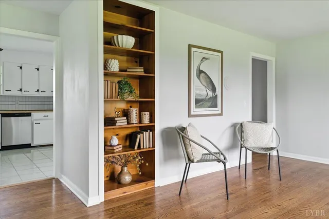 a view of a workspace room with wooden floor and a cabinet