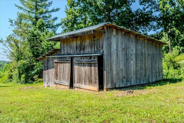 a backyard of a house with wooden fence