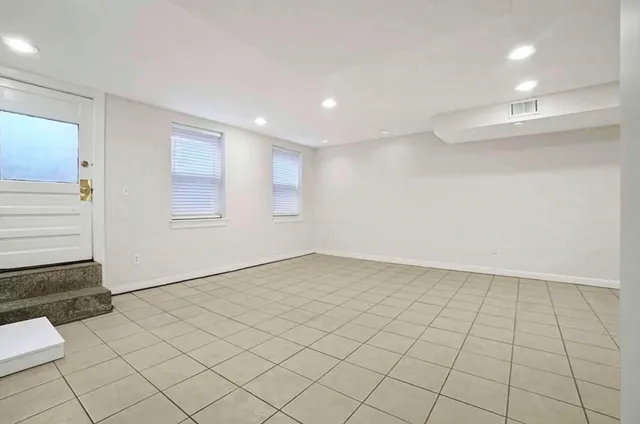 an empty room with windows