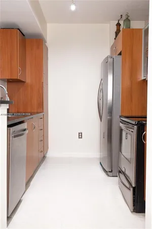 a view of yard with tall buildings