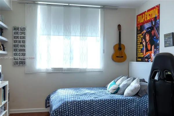 a bedroom with a bed and cabinets