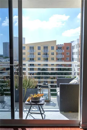 a living room with couches and a flat screen tv