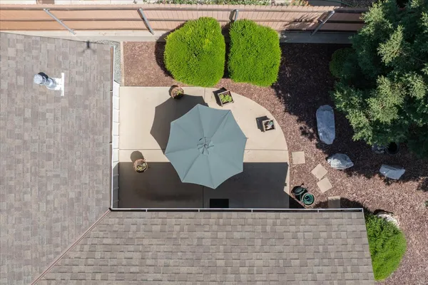 an aerial view of a house with a swimming pool
