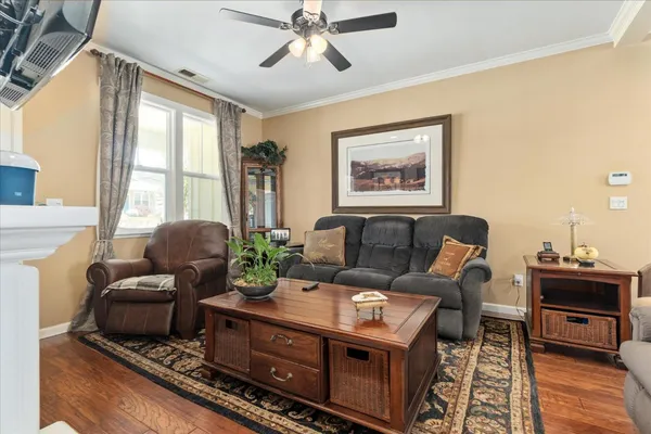 a living room with furniture and a fireplace