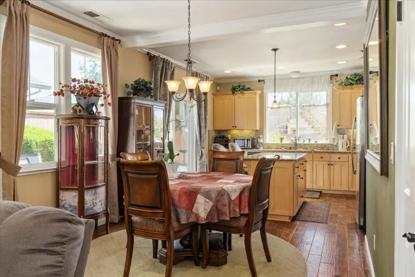 a dining room filled counter top space and a chandelier