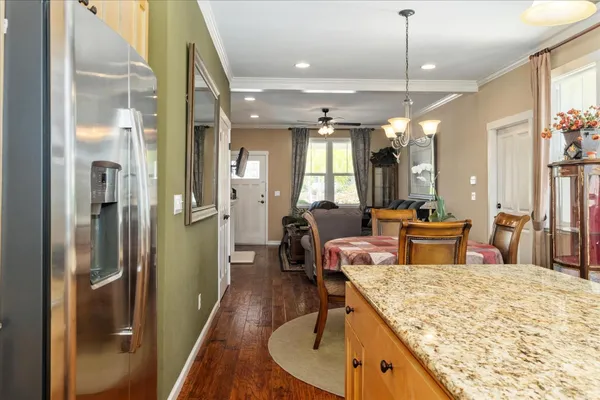 a view of a kitchen and dining room