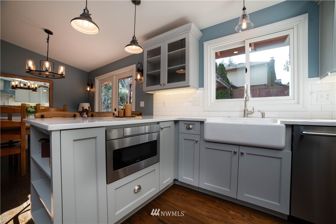 16714 3rd Avenue Southeast Bothell, WA 98012 - Photo 15 of 40 a kitchen with a sink and a stove top oven