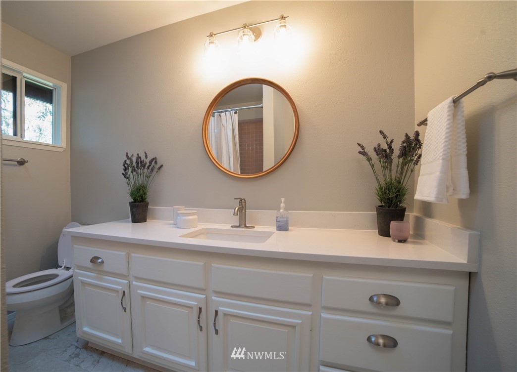 16714 3rd Avenue Southeast Bothell, WA 98012 - Photo 23 of 40 a bathroom with a toilet sink and mirror