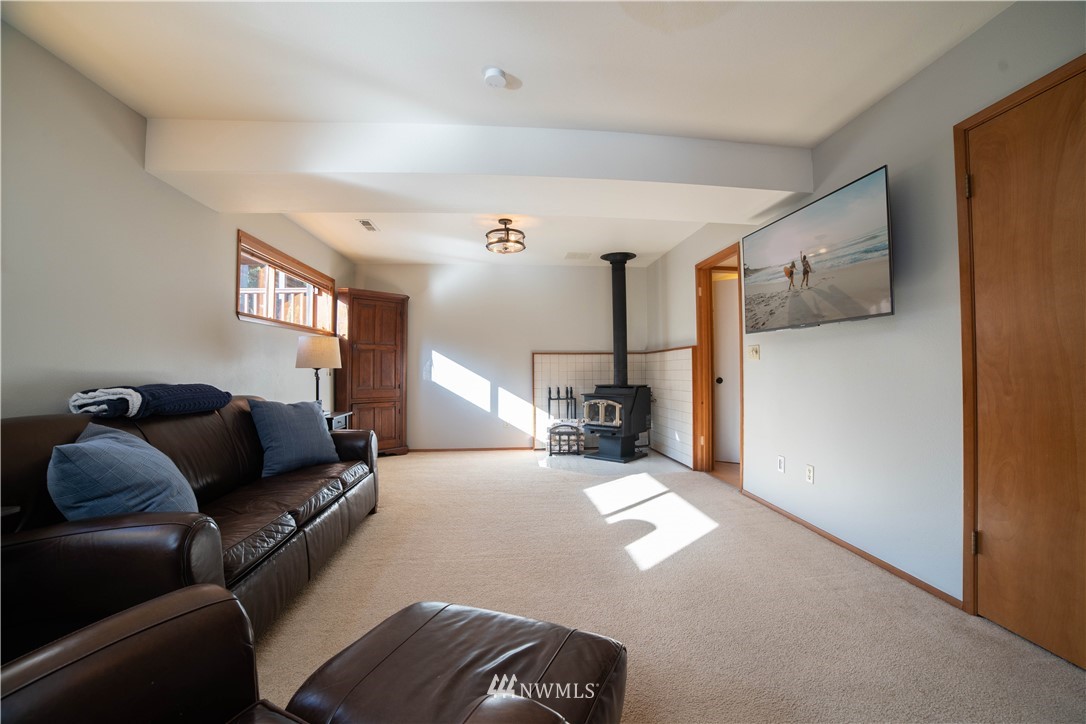 16714 3rd Avenue Southeast Bothell, WA 98012 - Photo 25 of 40 a living room with furniture and a flat screen tv