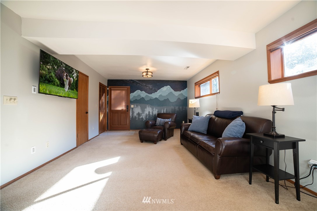 16714 3rd Avenue Southeast Bothell, WA 98012 - Photo 26 of 40 a living room with furniture and a fireplace