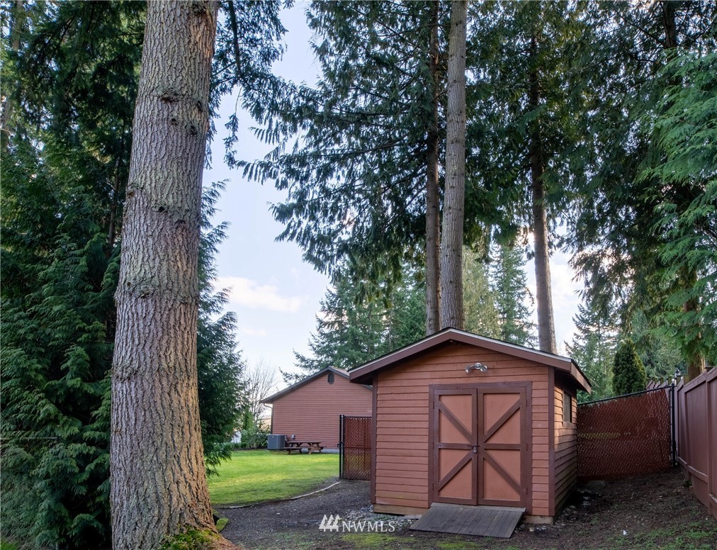 16714 3rd Avenue Southeast Bothell, WA 98012 - Photo 35 of 40 a view of backyard with barn and outdoor seating