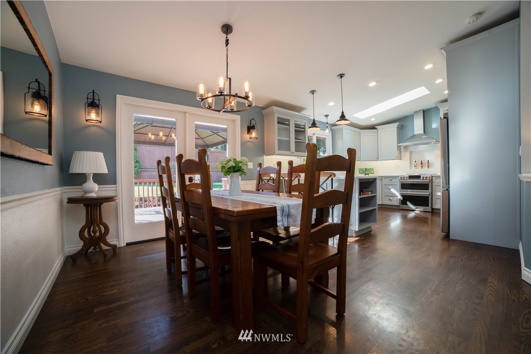 16714 3rd Avenue Southeast Bothell, WA 98012 - Photo 9 of 40 a view of a dining room with furniture and wooden floor