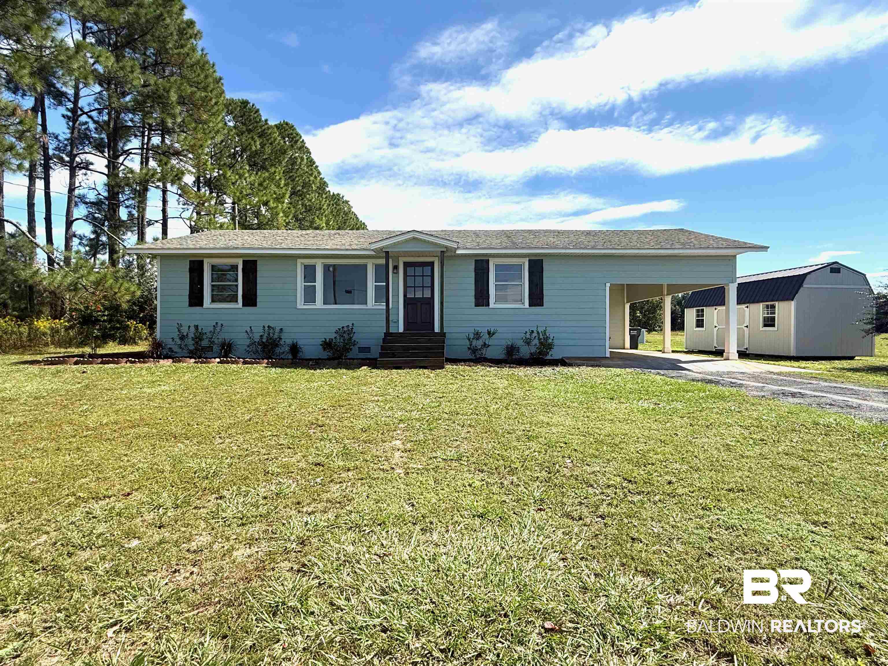 11698 Poser Road Foley, AL 36535 - Photo 1 of 20 Single story home with a front yard, an attached carport, driveway, and an outdoor structure