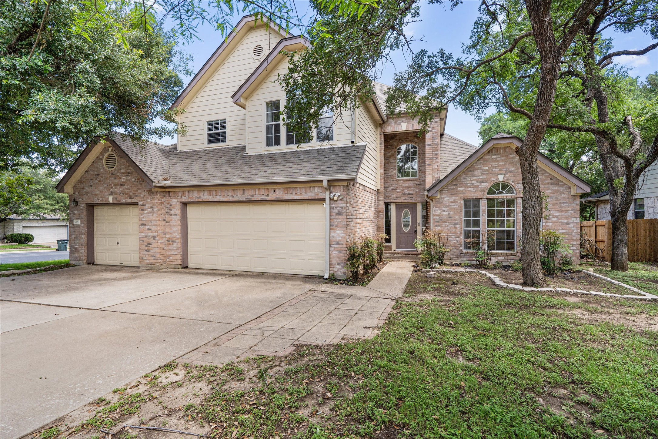 100 Parque Circle Georgetown, TX 78626 - Photo 1 of 39 a front view of a house with a yard and garage