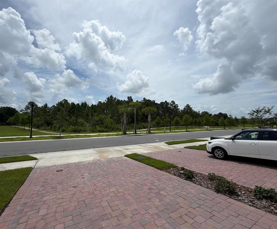 4256 Ranch House Road St. Cloud, FL 34772 - Photo 23 of 30 a view of a street with a car parked