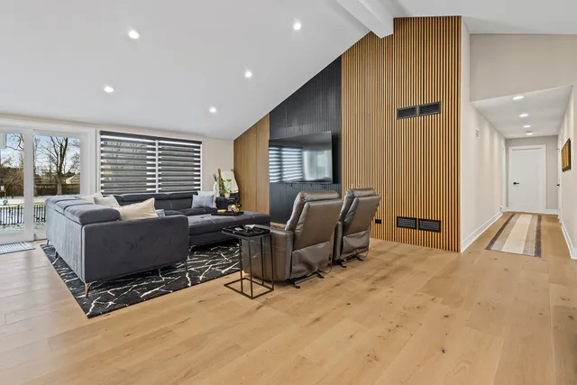 a kitchen with kitchen island granite countertop a sink counter top space appliances and cabinets