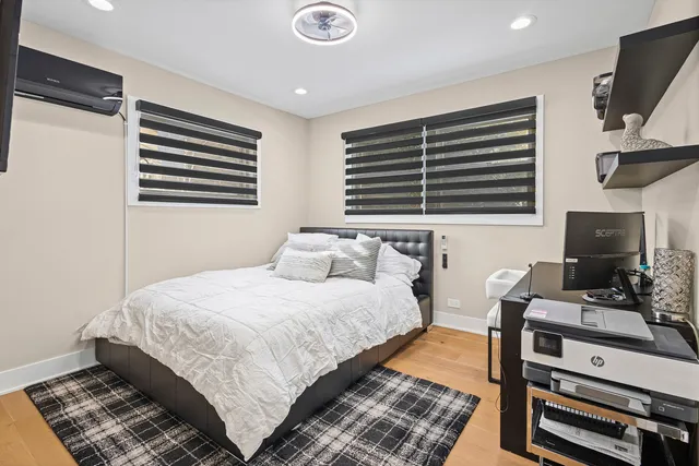 a bedroom with bed and a desk