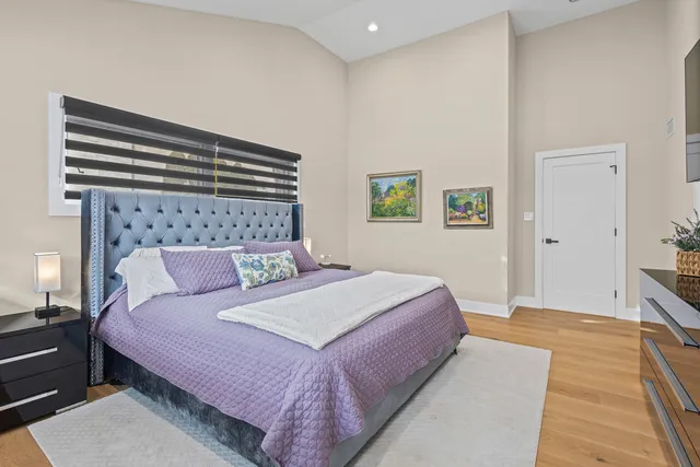 a view of hallway with stairs and wooden floor