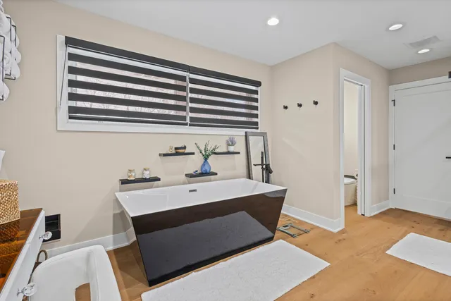 a kitchen with stainless steel appliances a stove a refrigerator and a microwave