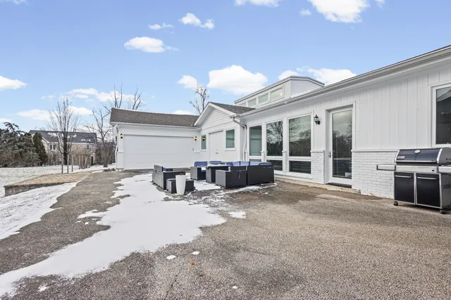 a view of a backyard of the house