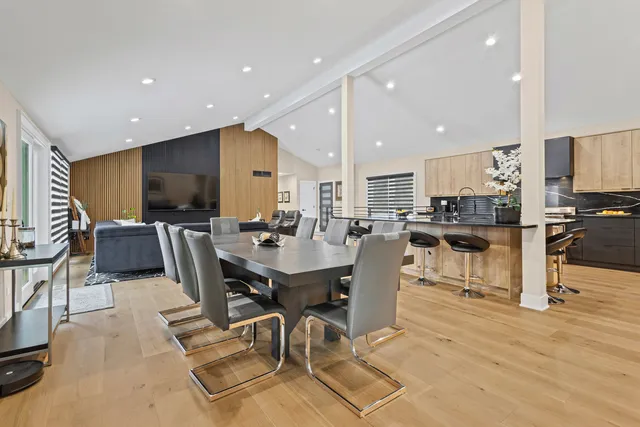 a living room with furniture and large windows