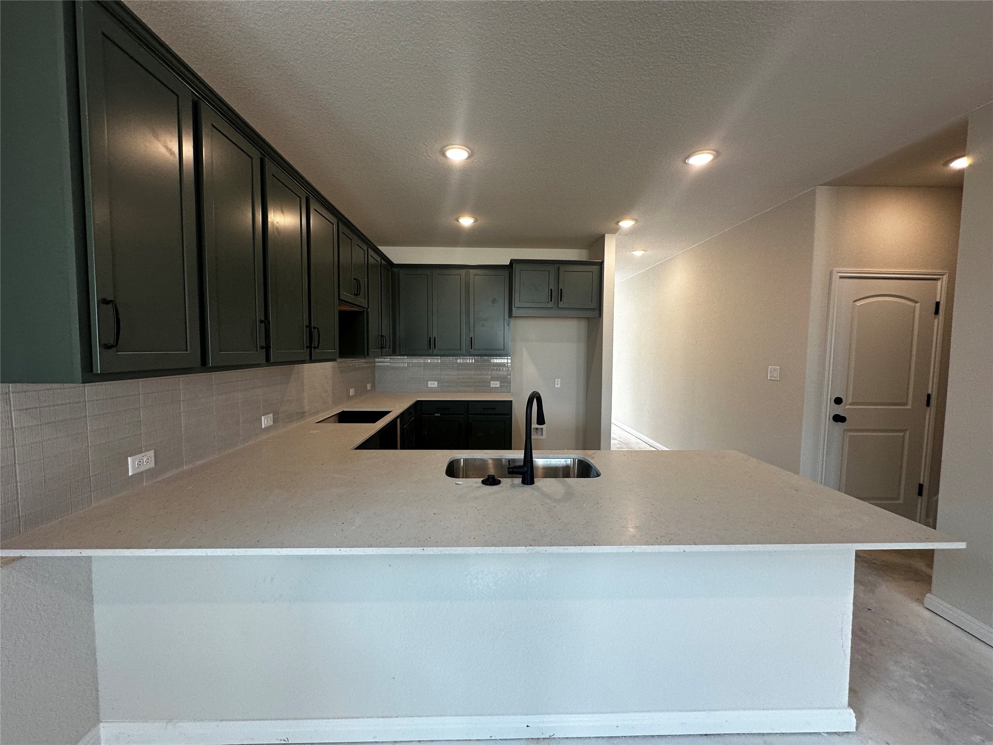 1053 Sienna Bear Road Georgetown, TX 78633 - Photo 7 of 32 a view of a kitchen with a sink and dishwasher