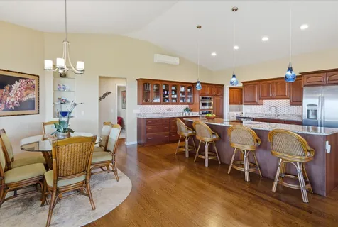 a view of a dining area with furniture and chandelier