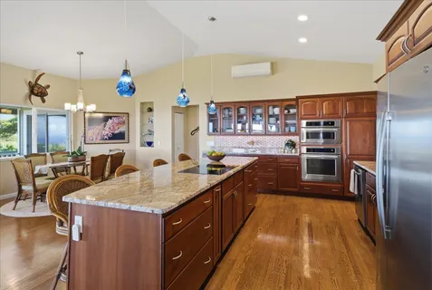 a kitchen with counter top space cabinets and stainless steel appliances