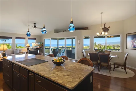 a kitchen with sink cabinets and dining table