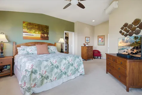 a bedroom with a bed and dresser