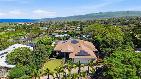 an aerial view of a house with a garden