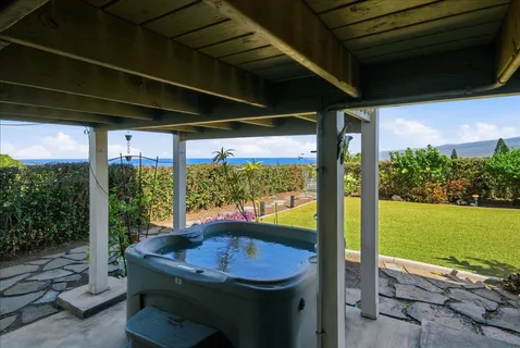 a view of a porch with furniture and yard