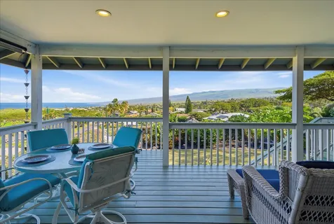 a view of a balcony with chairs
