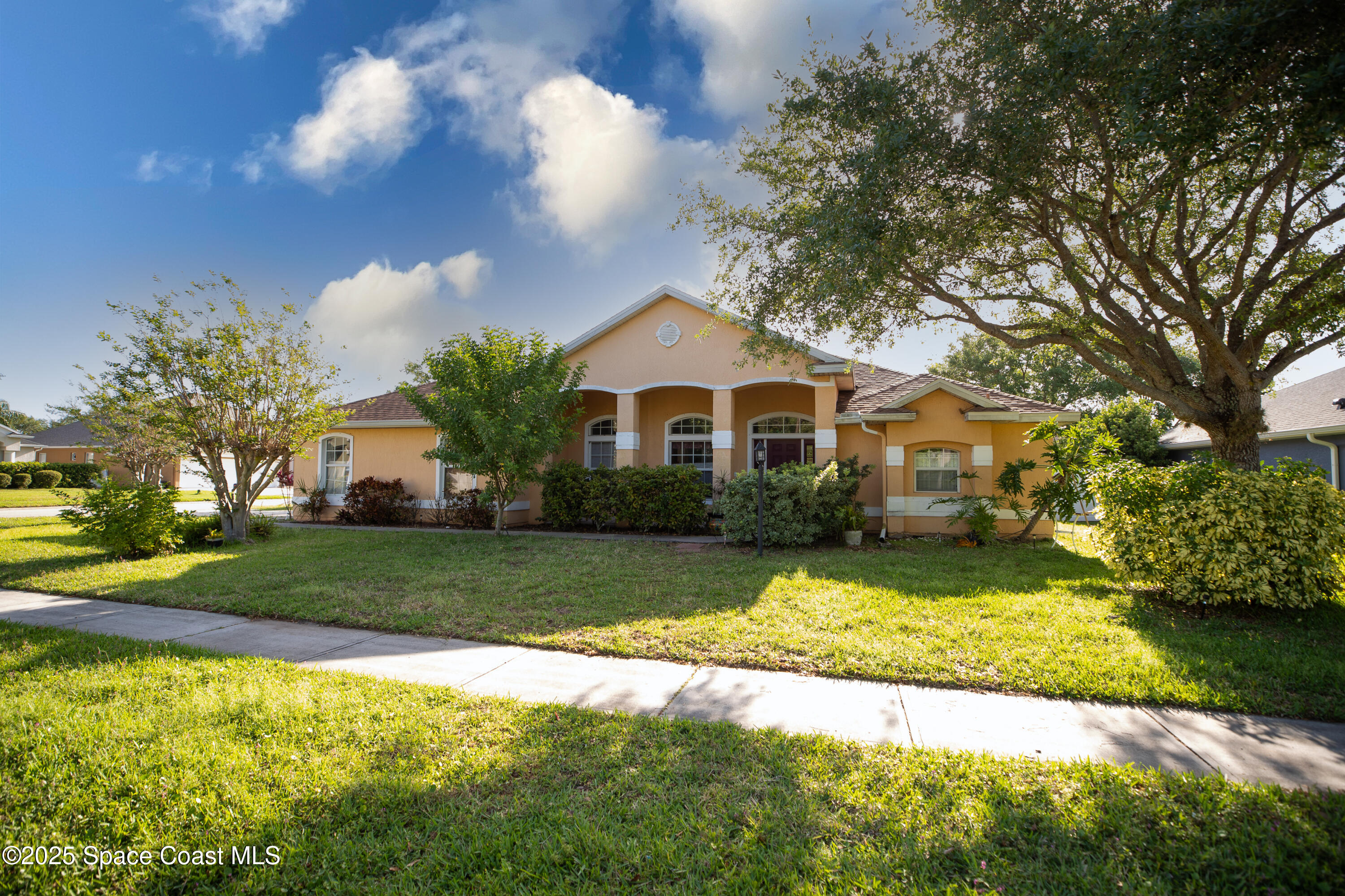 483 Wynfield Circle Rockledge, FL 32955 - Photo 3 of 30 a front view of a house with a yard and garage
