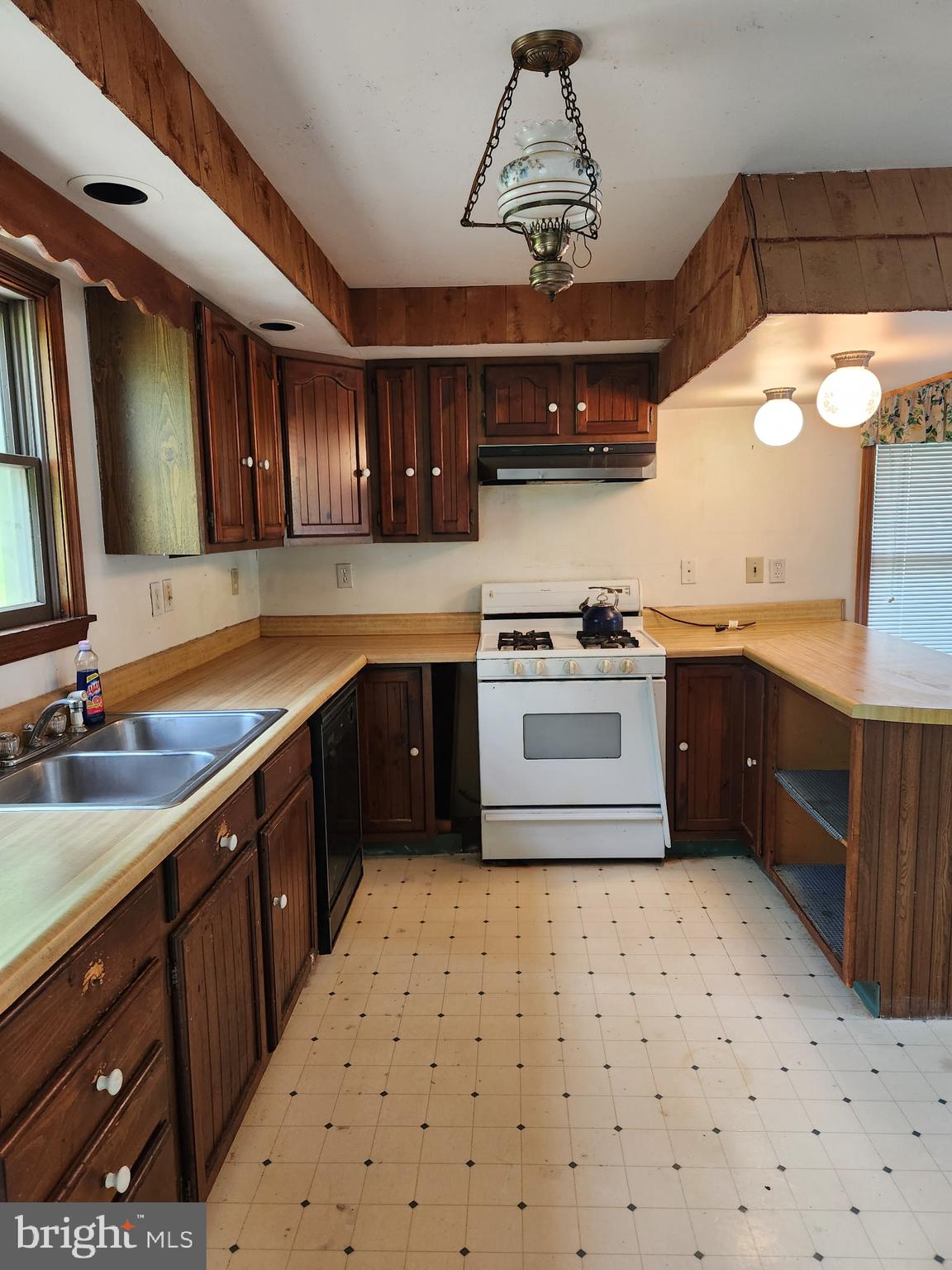 1422 Big Run Road Everett, PA 15537 - Photo 7 of 35 a kitchen with a stove sink and cabinets