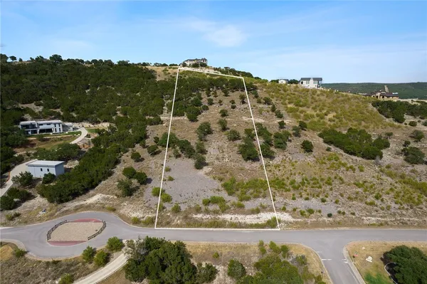 a view of a yard with a mountain