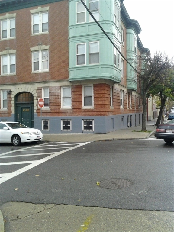 a view of a car park in front of a building