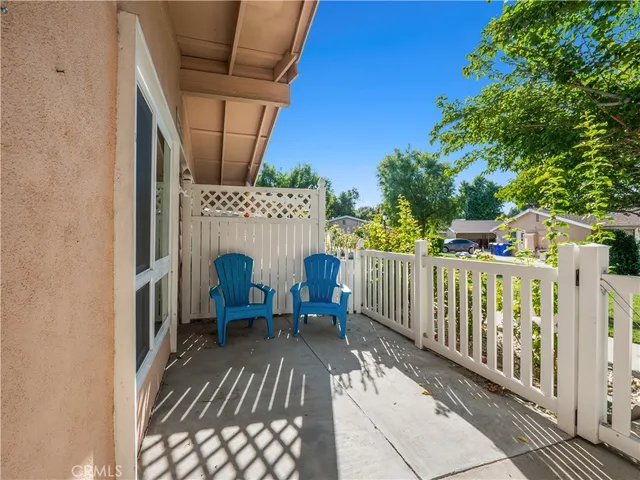 a view of balcony with furniture