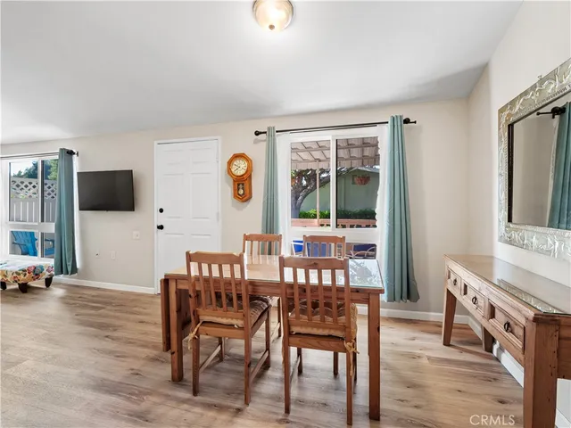 a view of a livingroom with furniture and a flat screen tv