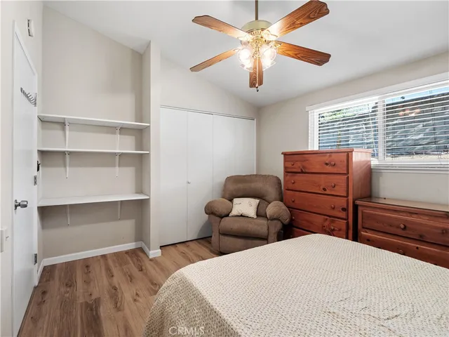 a bedroom with bed and window