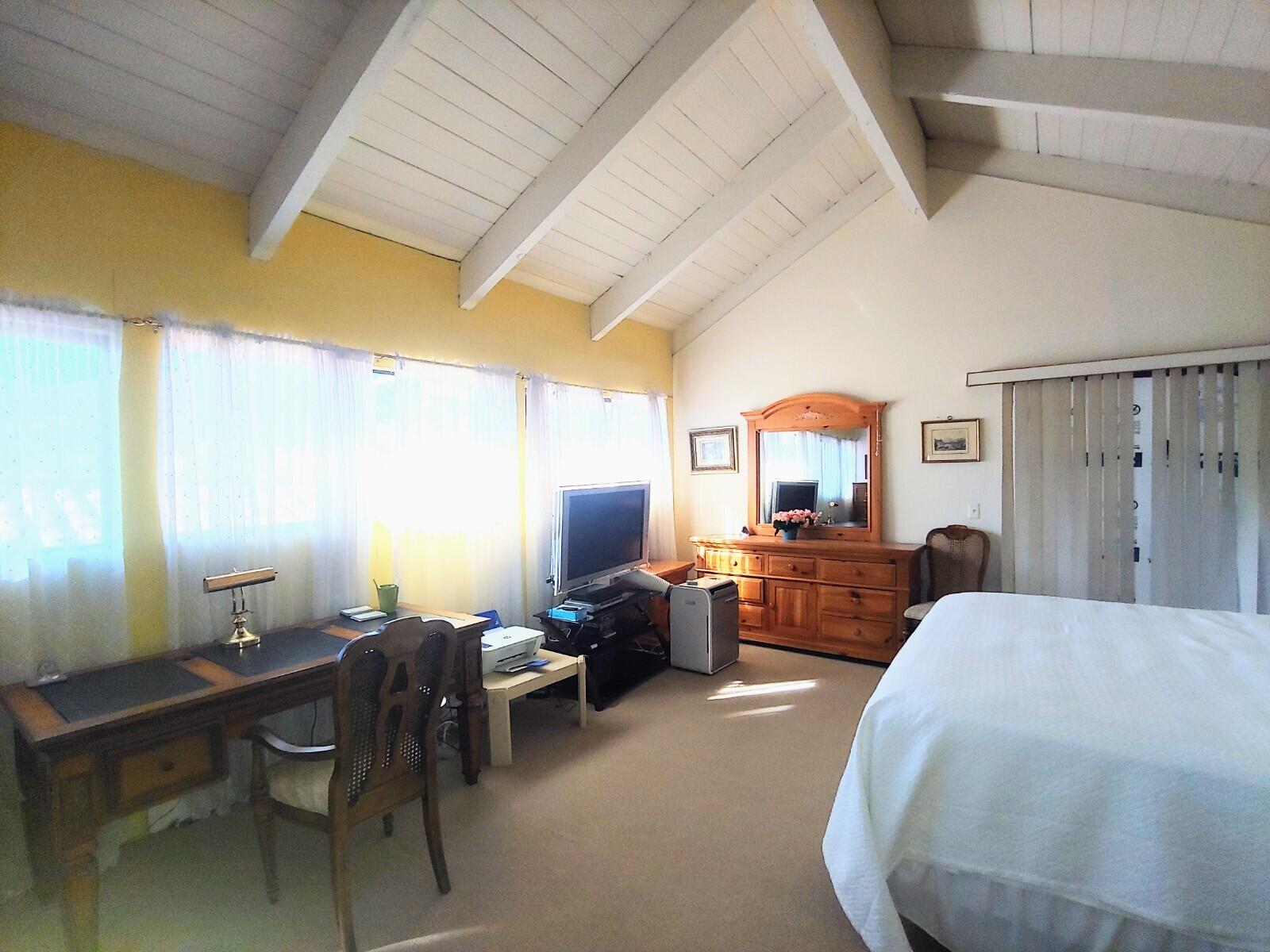 69940 Los Cocos Court Rancho Mirage, CA 92270 - Photo 22 of 37 a bedroom with furniture and a wooden floor