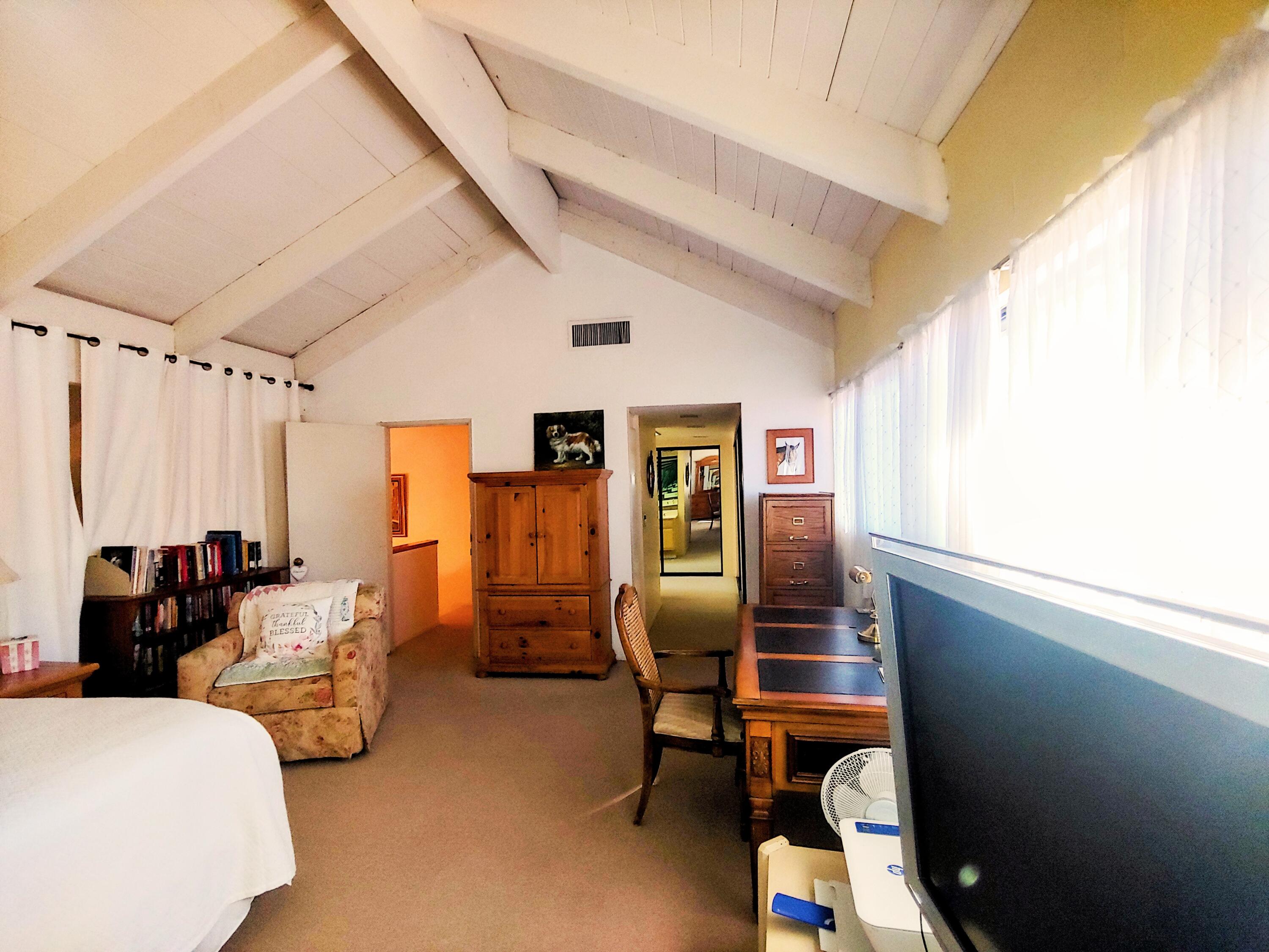 69940 Los Cocos Court Rancho Mirage, CA 92270 - Photo 23 of 37 a bedroom with furniture and a window