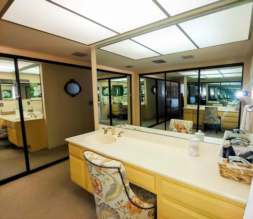 a bathroom with a tub sink and mirror
