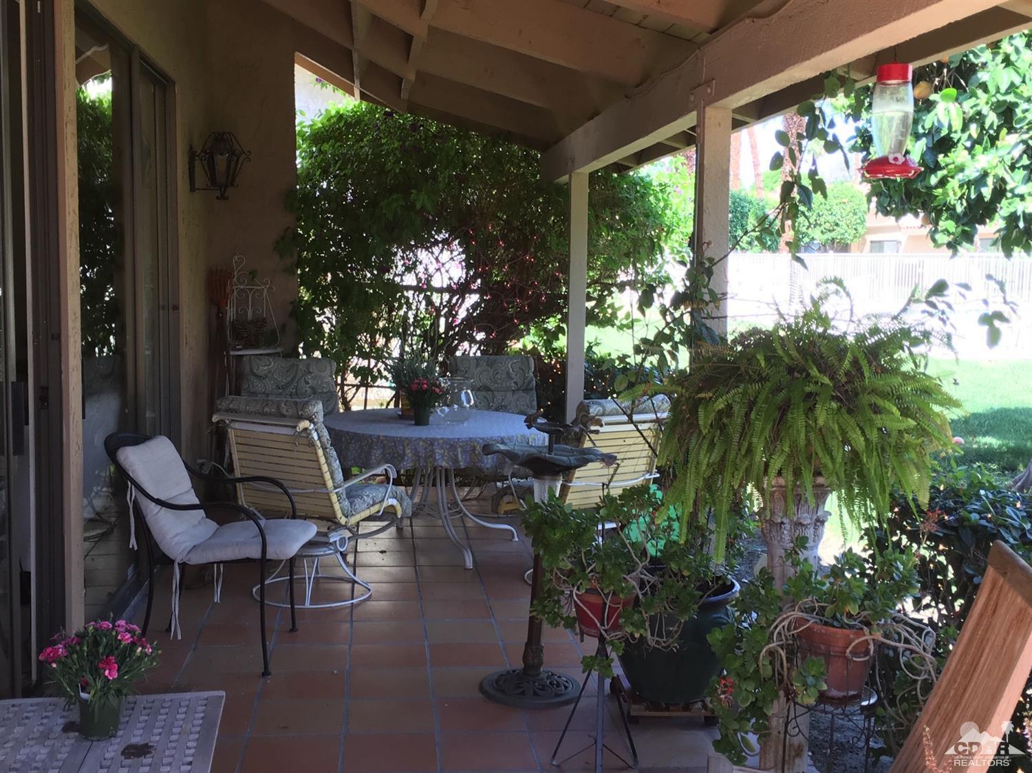 69940 Los Cocos Court Rancho Mirage, CA 92270 - Photo 30 of 37 a outdoor living space with furniture and garden view
