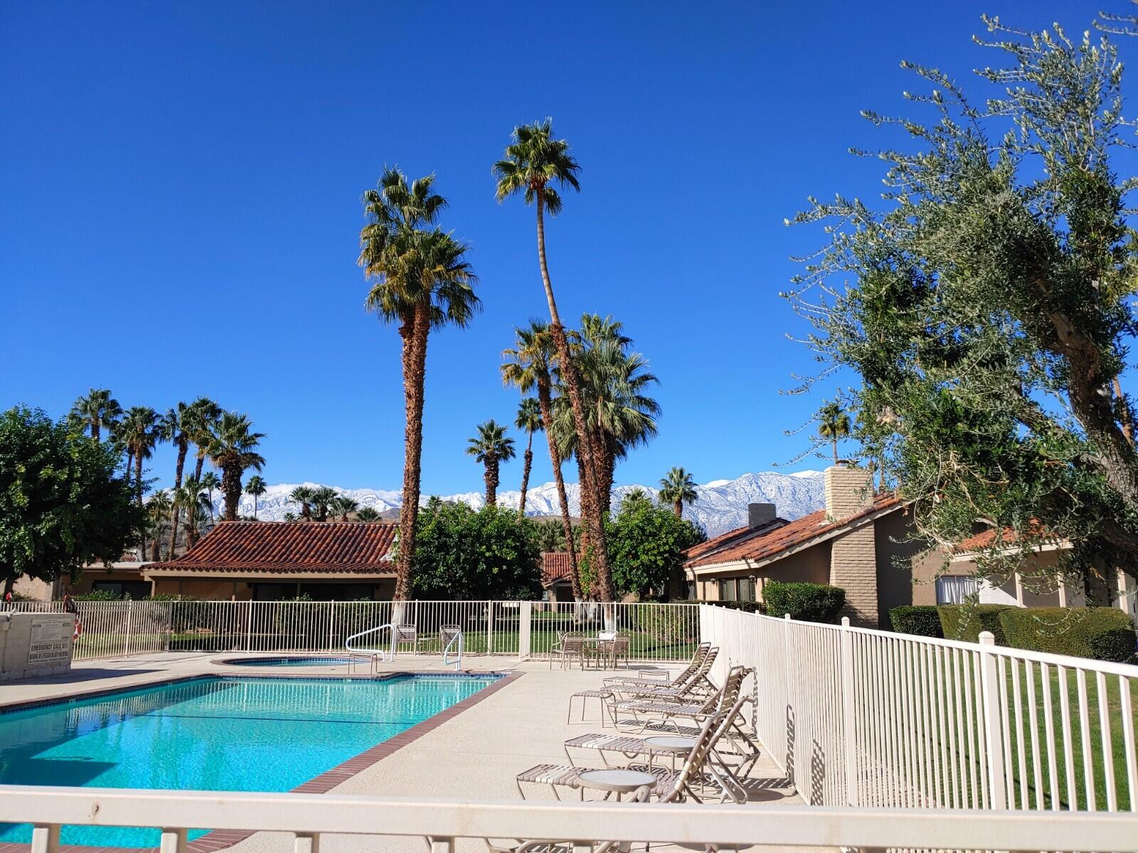 69940 Los Cocos Court Rancho Mirage, CA 92270 - Photo 31 of 37 a view of a swimming pool with a patio and a yard