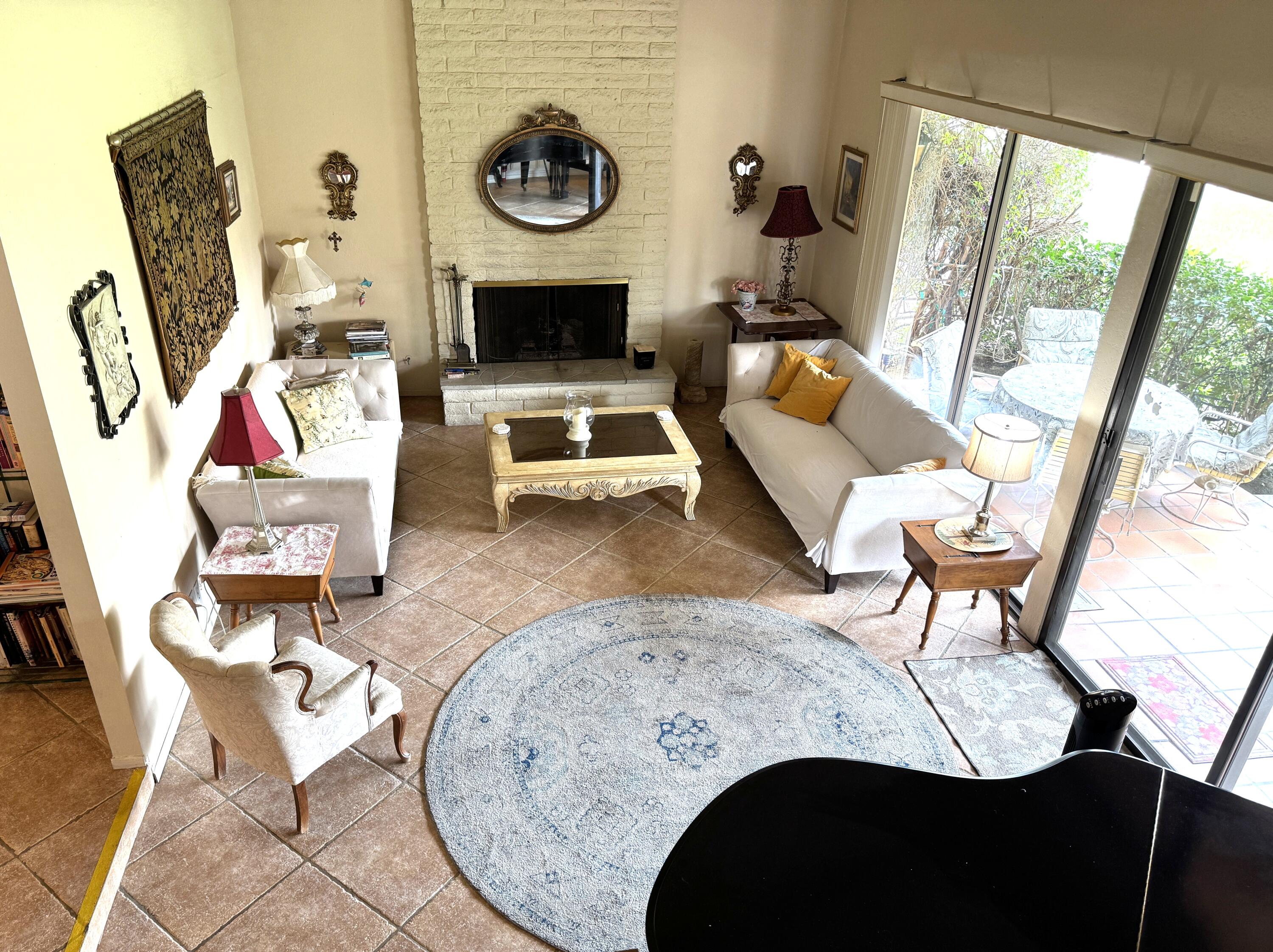69940 Los Cocos Court Rancho Mirage, CA 92270 - Photo 5 of 37 a living room with furniture and wooden floor