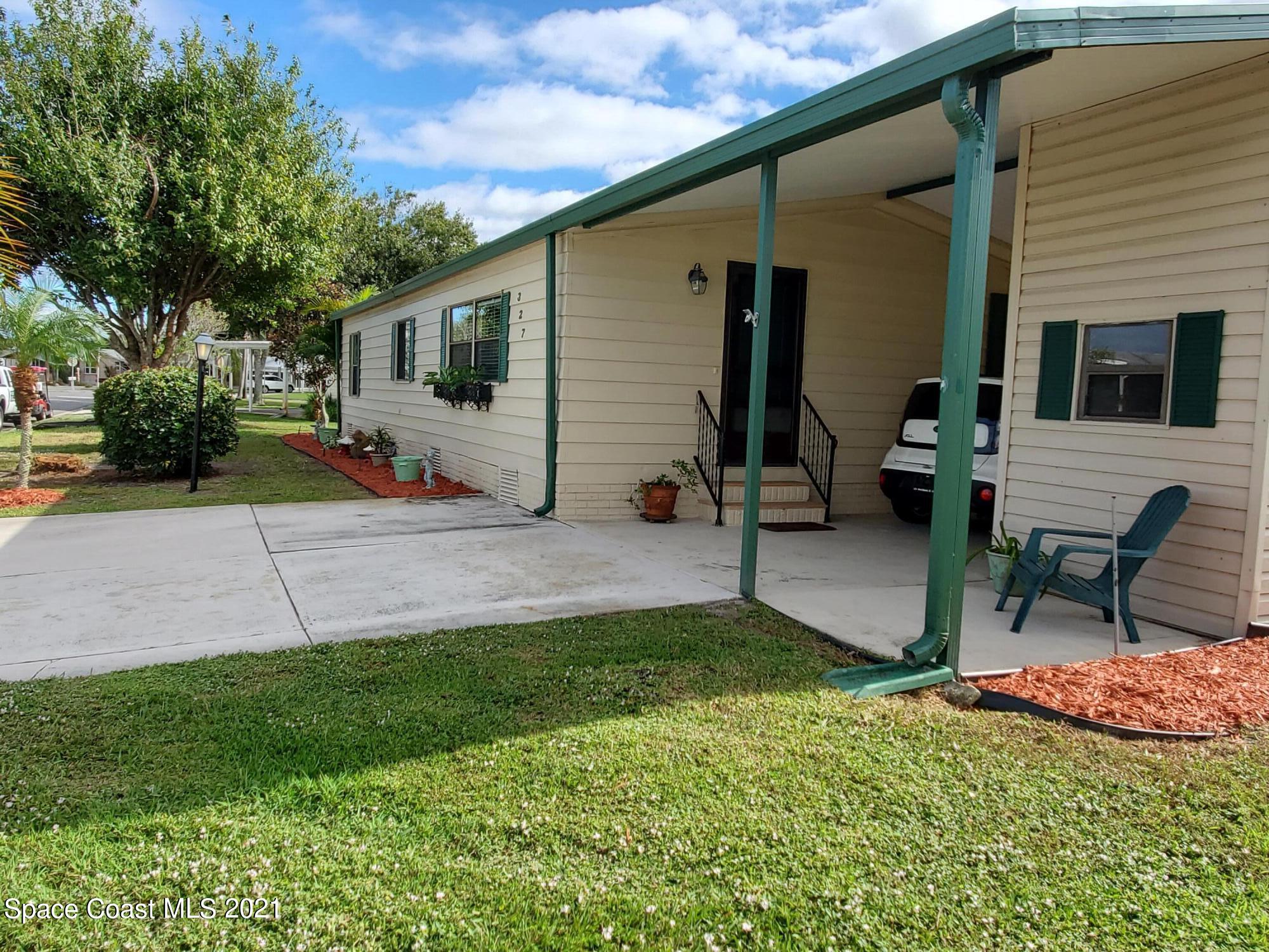 327 Macadamia Drive Sebastian, FL 32976 - Photo 1 of 31 a view of a house with backyard and sitting area